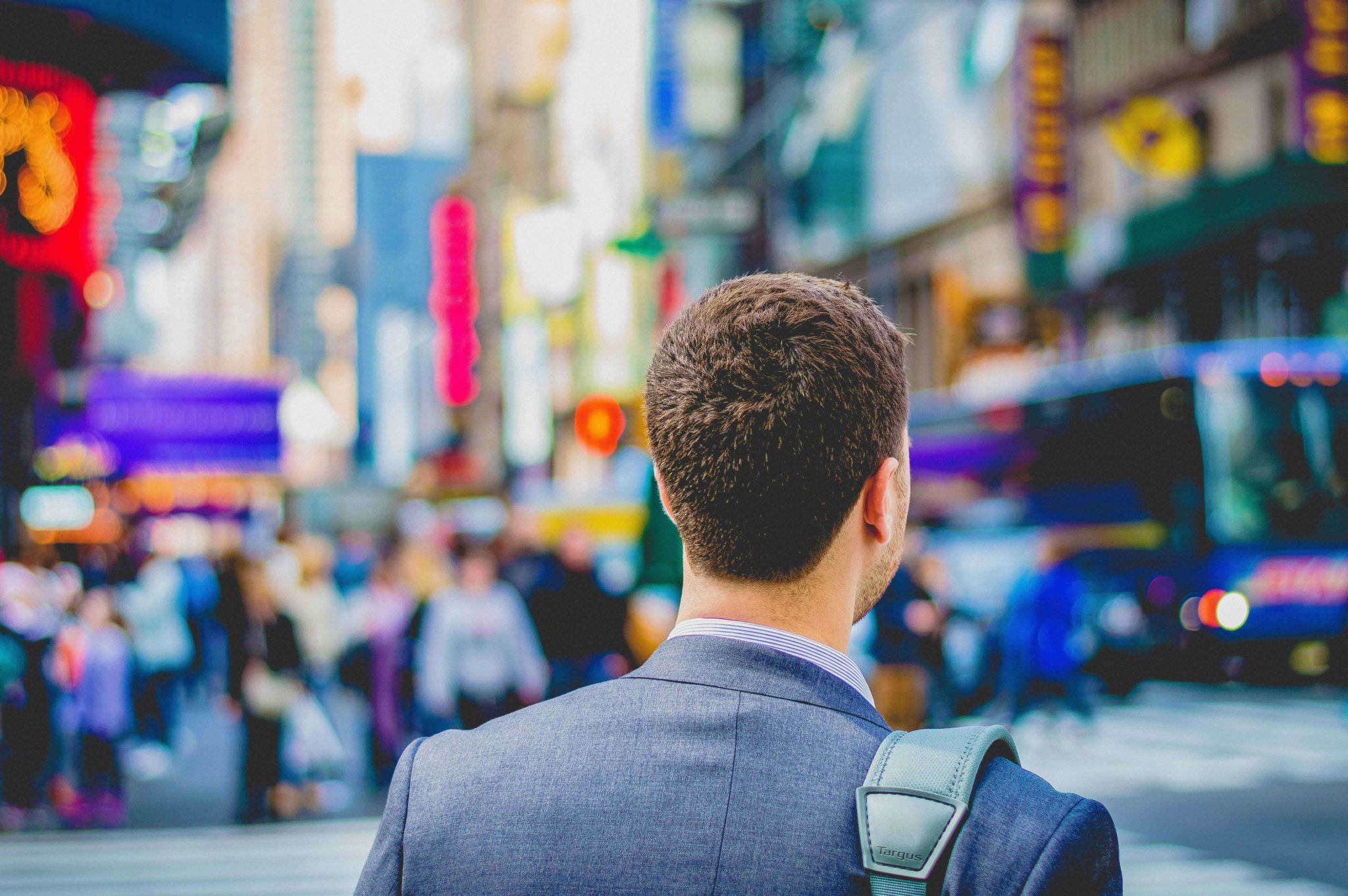 Man in a city thinking about leadership capability