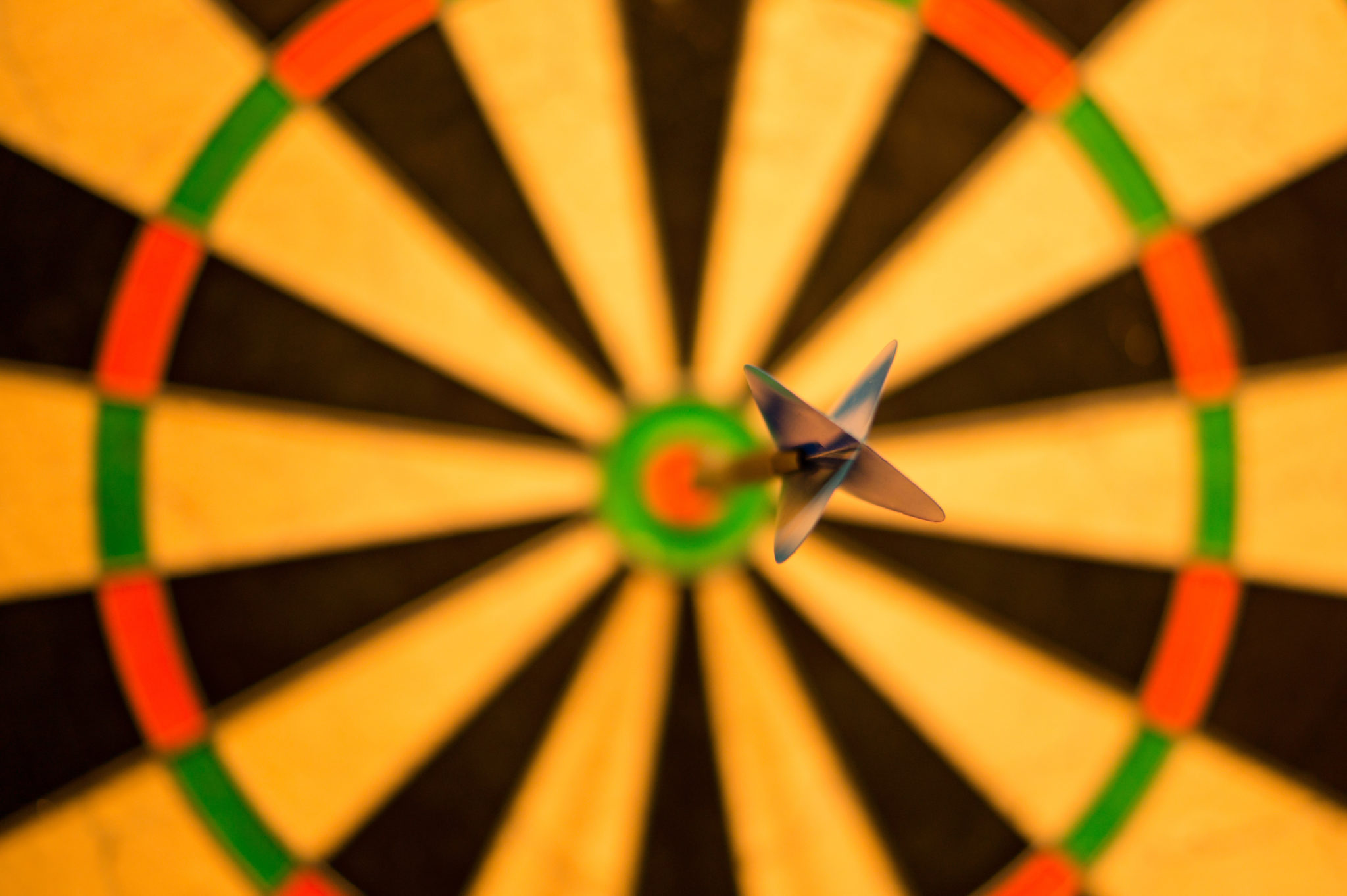 Dart hitting dartboard